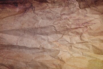 Texture of crumpled parchment paper as background, top view