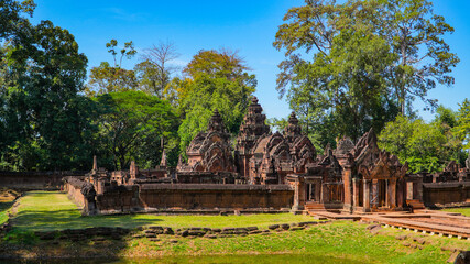 Fototapeta na wymiar Mysterious Ancient ruins Banteay Srei temple - famous Cambodian landmark, Angkor Wat complex of temples. Siem Reap, Cambodia.