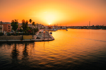Port of old Taranto on the sea at sunset