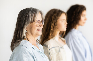 Cheerful pretty caucasian teen, millennial and old women