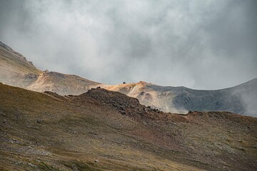 Fototapeta na wymiar volcano in the dark clouds