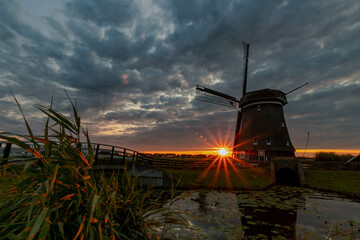 dutch windmill at sunset