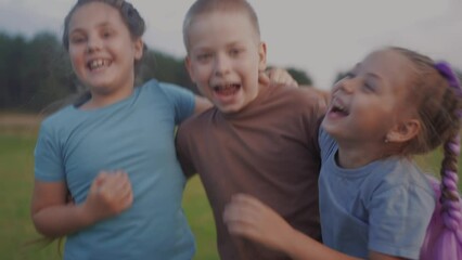 team children hugging jumping shouting rejoice success. happy family kid dream concept. a group of children embraced in nature in the park play jump hug together. lifestyle teamwork concept - Powered by Adobe
