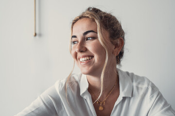 Smiling young caucasian business woman head shot portrait. Thoughtful millennial businesswoman...