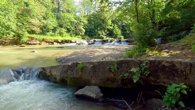 Beautiful summer scene of Pid Skelyamy waterfall. Splendid morning view of Sukel' River. Nice landscape of Carpathian mounatains, Ukraine, Europe. 4K video (Ultra High Definition).