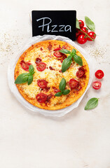 Italian pizza Margherita with cheese, tomato sauce and basil.