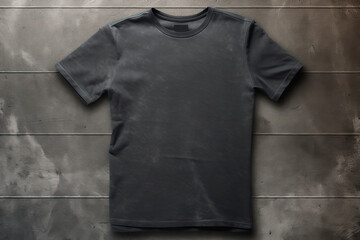 A blank black t-shirt in front of an urban gray wall. T-shirt mockup for presentation. - obrazy, fototapety, plakaty