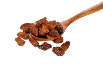 Wooden spoon with raisins on a white background.