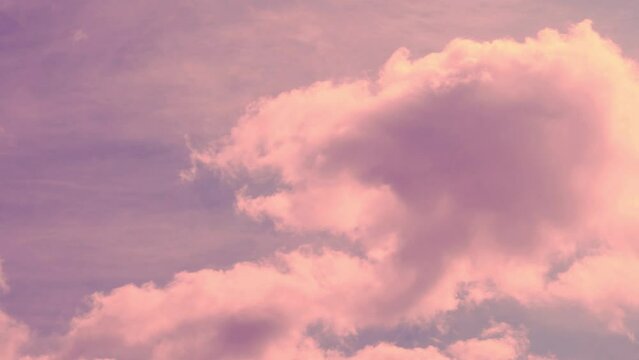 Beautiful Time Lapse Puffy Cumulus Orange Pink Clouds in Blue Orange Evening Sky at Sunset in Sunlight. Fluffy Colorful Sunset Clouds in Colored Sky. Atmosphere, Aerial View, Beauty, Relax, Background