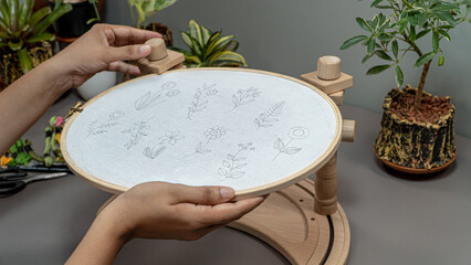 Floral Elegance: Craftswoman's Embroidery Creations