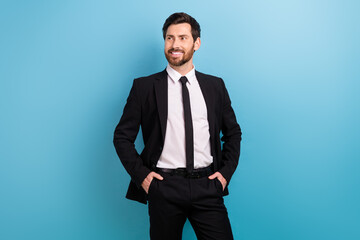 Photo of confident dreamy man specialist wear black tuxedo looking empty space isolated blue color background