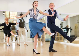 Deurstickers Dansschool Adult dancing couple enjoying active swing