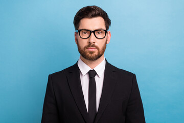 Portrait of serious businessman young age bristle wear classic stylish new eyeglasses executive director isolated on blue color background