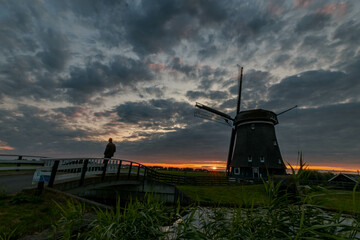 dutch windmill at sunset