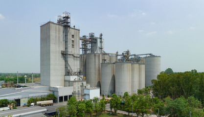 Animal feed factory. Agricultural silos, grain storage silos. Agriculture industry. Rural agribusiness. Grain storage innovation. Agricultural silos at animal feed factory. Sustainable farming. © Artinun
