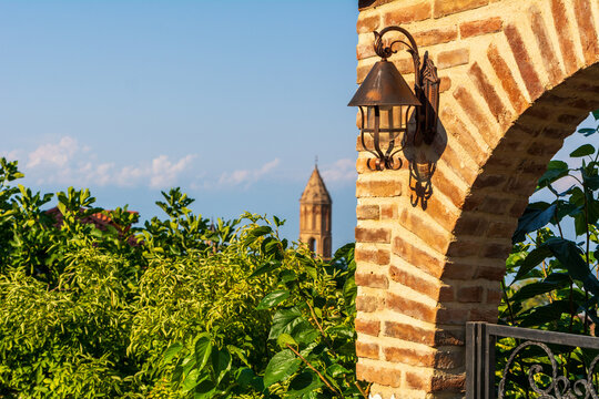Arched wall with an old lamp in the Town of Sighnaghi in Georgia