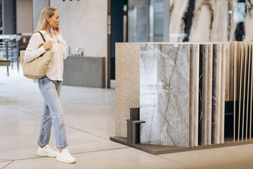 Woman walking at the bulding materials and tiles market