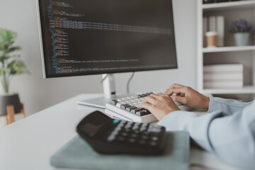 Female programmer typing on computer keyboard, programmer designing custom computer programming,...