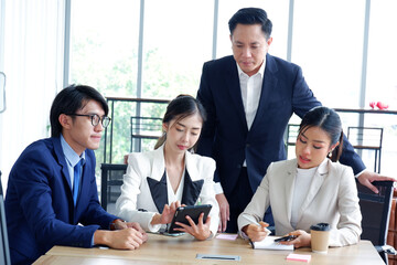 Businessman and employee meeting to plan marketing business idea.