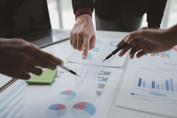 Two businessmen are discussing analyzing company financial papers, operating and marketing planning meetings for a growing and profitable company. Business meeting concept.