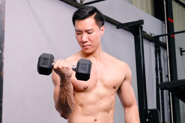 young man exercising in the gym fitness concept.