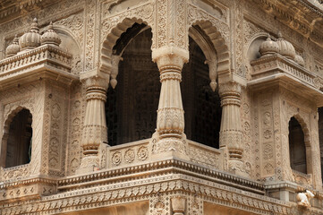 Carving details on the outer wall of Shri Ahilyeshwar Mandir, situated in Ahilya Devi Fort complex...