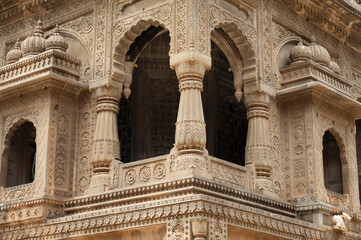 Carving details on the outer wall of Shri Ahilyeshwar Mandir, situated in Ahilya Devi Fort complex on the banks of River Narmada, Maheshwar, Madhya Pradesh, India