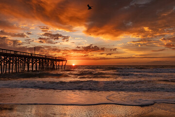 Sunrise over the Pawley's Island fishing Pier one week after half the pier was destroyed by...