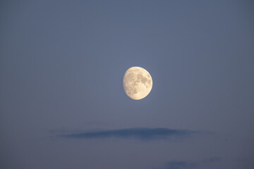 Naklejka na ściany i meble moon in the blue sky with white clouds background