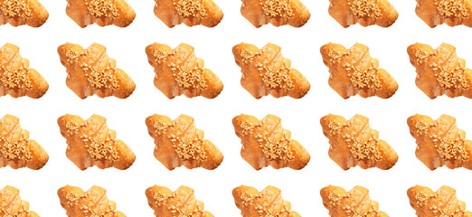 Pattern fresh classic french croissant isolated on white background. With clipping path. Creative bakery food background, cut out croissant sprinkled with nuts. Sweet pastry, dessert 