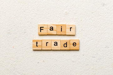 fair trade word written on wood block. fair trade text on cement table for your desing, concept