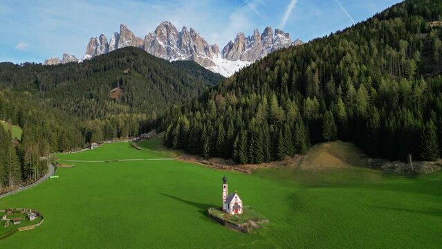 Spring landscape with shurch in Santa Magdalena village, Italian Dolomites Alps, in South Tyrol, Val di Funes, Italy, 4k