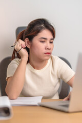 stressed Asian Woman using laptop, Tired female businesswoman working overload with headache and Sleepy at office, Exhausted casual woman with computer at late night in home. Work Life Balance concept