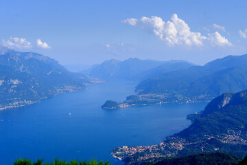 Fototapeta na wymiar aerial view of Como Lake landscape in beautiful summer day, trees, water and mountains, Italy, Europe, concept summer vacation, travel and enjoyment