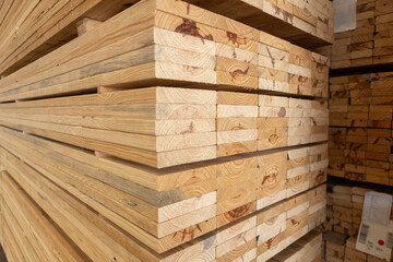 Stack of raw wood, Lumber warehouse storage wooden. Timber goods storehouse. wood import-export industry.