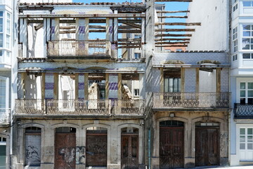 Facade of two ruined houses on Santa Lucia Street, in the city of Coruna Coruna, Galicia, Spain 07262023