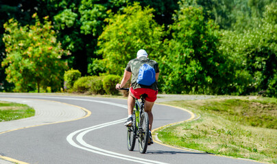 Cyclist ride on the bike path in the city Park
