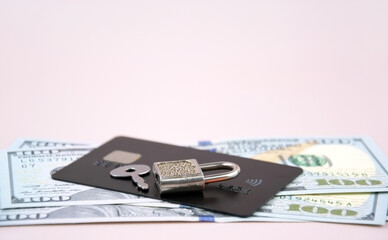 Financial fraud protection concept: credit card, padlock and master key.