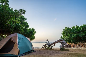 Photo sur Plexiglas Plage de Camps Bay, Le Cap, Afrique du Sud Travel camping at sunrise on shore under the trees, Outdoor lifestyle concept.