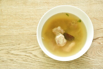 boiled chop braised pork bone with black mushroom in Chinese herb soup on bowl 