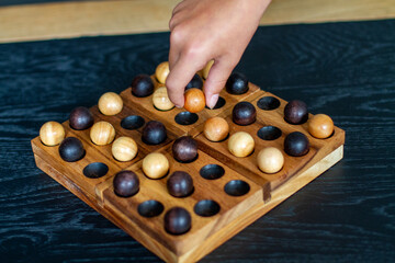 play the strategy wooden board game