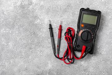 Electrician equipment on marble background with copy space.Top view.Electrician tool set.Multimeter, tester,screwdrivers,cutters,duct tape,lamps,tape measure and wires.Flet lay. Construction concept. © Avocado_studio