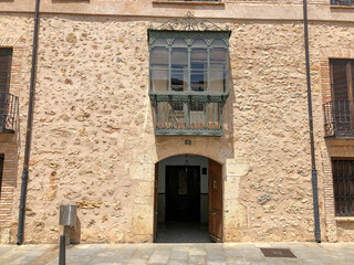 Fototapeta na wymiar Medieval facade with projecting balcony.