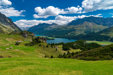 Fototapeta na wymiar A view of Lake Sils and the Engadine from above. Panorama from Maloja and Grevasalvas 