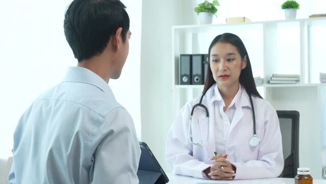 4k slow motion of asian female doctor specialist and male patient discussing Flu (influenza) is infection of nose, throat, lungs, respiratory system. head, body aches, sore throat, fever, respiratory
