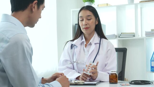 4k slow motion of asian female doctor specialist and male patient discussing prostate cancer, Urologist, Radiation oncologist diagnoses, treats cancers affect urinary tract, male reproductive organs