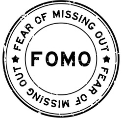 Grunge black FOMO fear of missing out word round rubber seal stamp on white background
