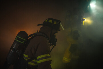 Firefighters In A Smoky Building