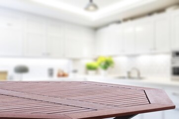 Wooden empty tabletop for product mockup on kitchen background