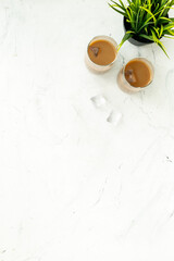 Obraz na płótnie Canvas Two glasses of cold drew coffee drink with ice, top view